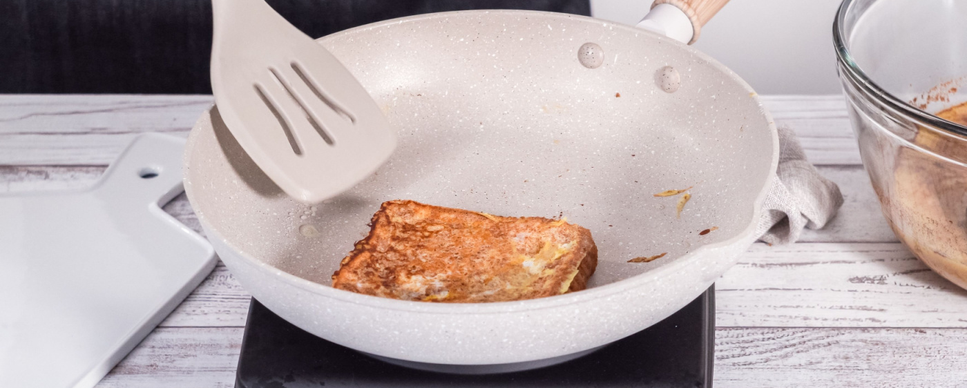 Decorative French toast being toasted in a skillet.