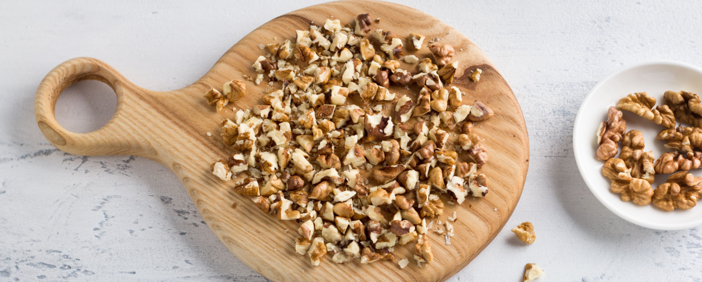 Decoration Chopped walnuts on a board Baked Brie