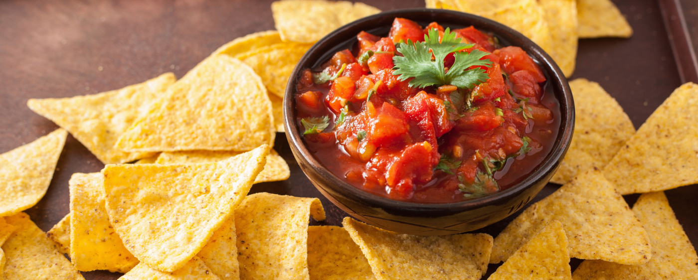 Decorative Homemade salsa paired with tortilla chips.